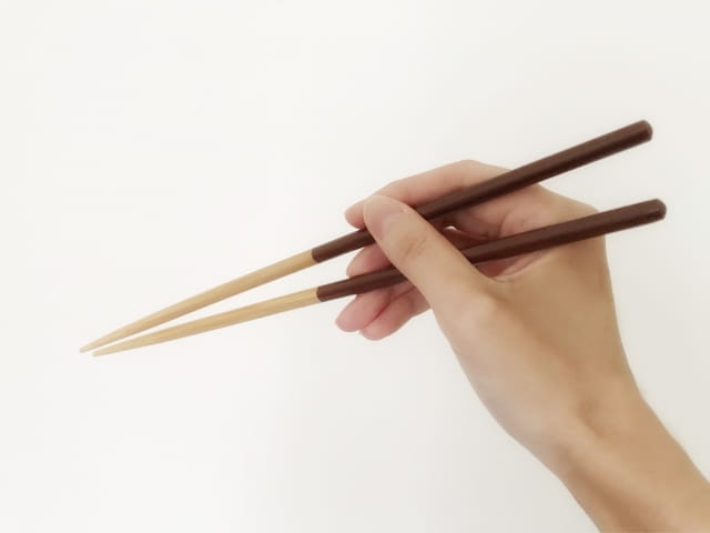 holding chopsticks