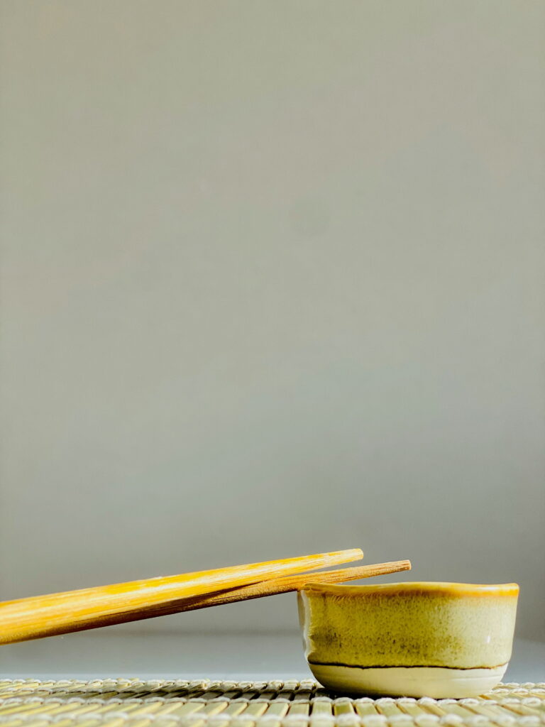 putting chopsticks on plate